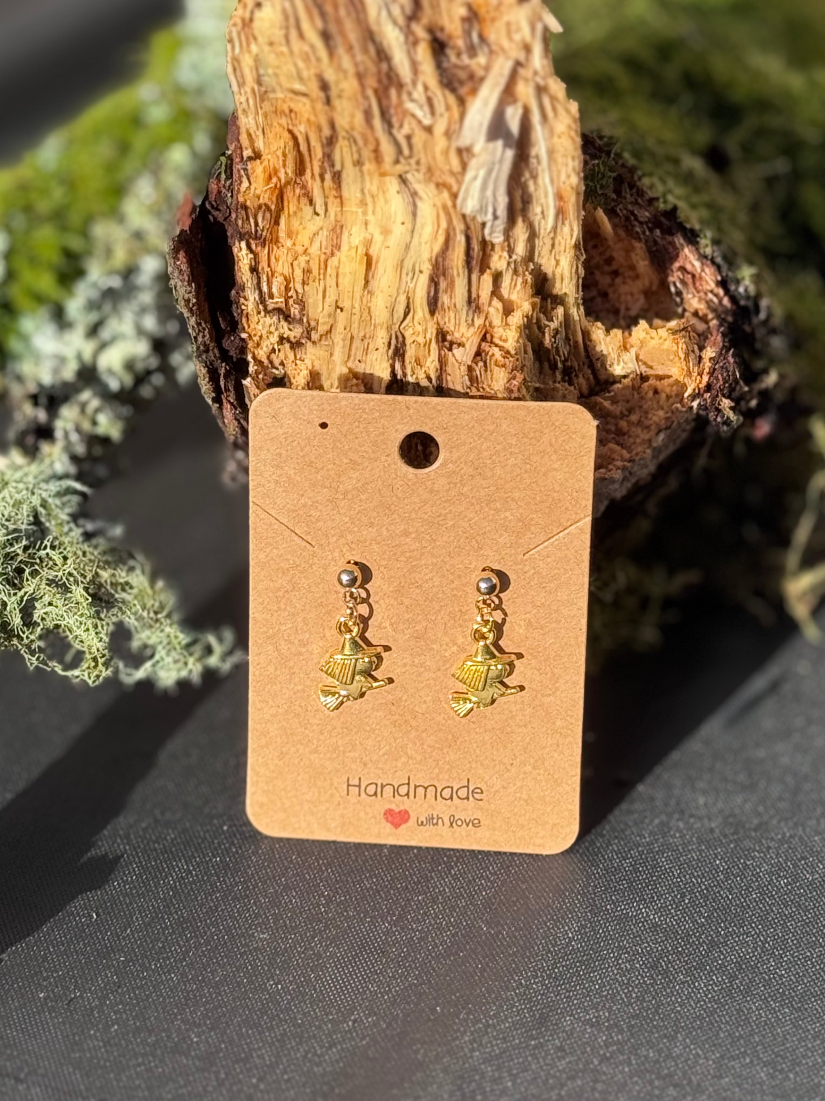 Gold witches on a broom