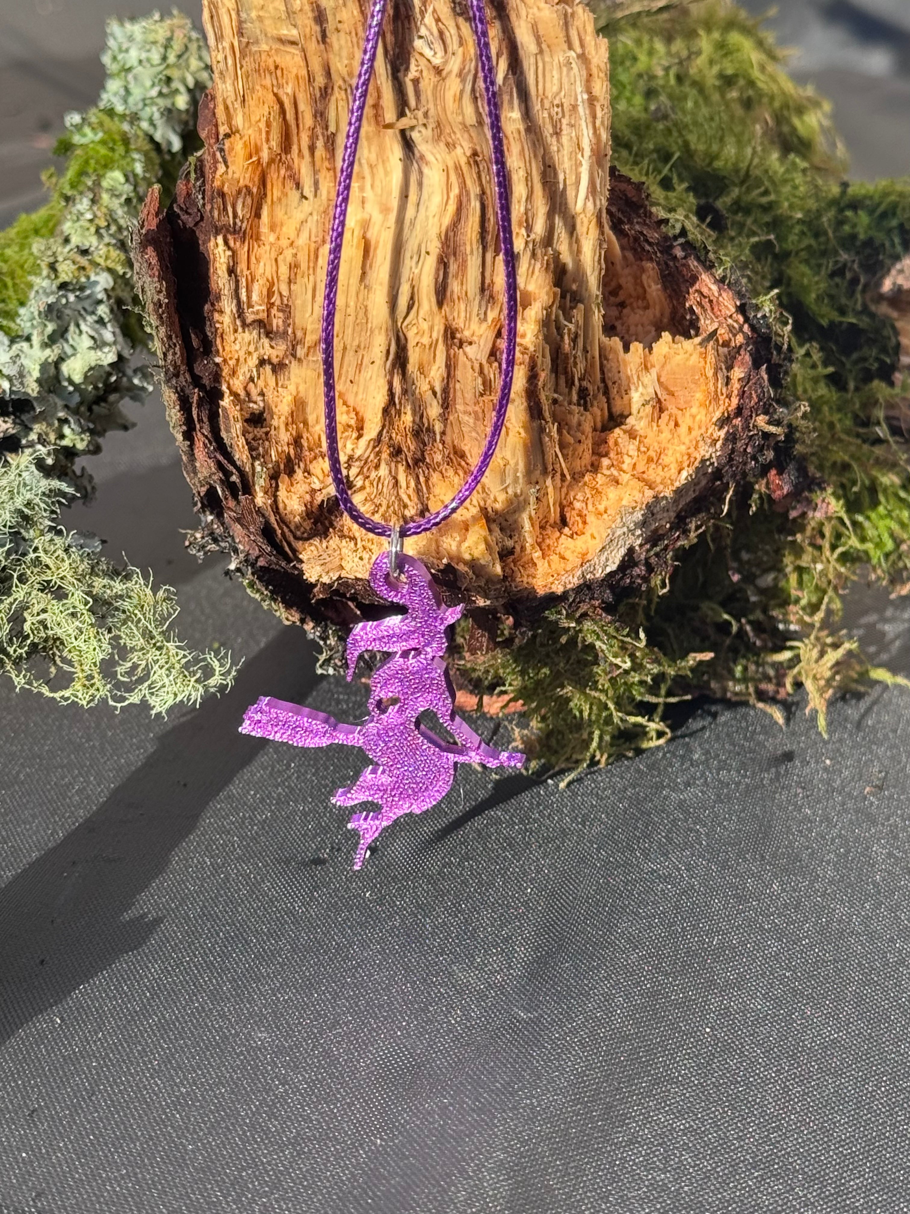 Witch on a broom necklace